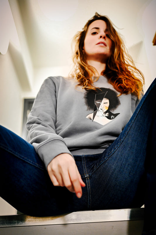 organic cotton and recycled polyester sweatshirt featuring a hand-drawn illustration of the face of a female warrior